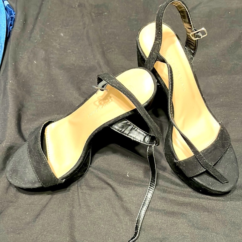Black high heel size 7.5 never used no tags.